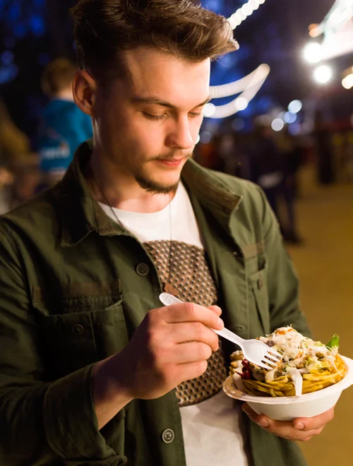 handsome-young-man-eating-chips-in-the-street-2024-09-22-06-15-21-utc copy